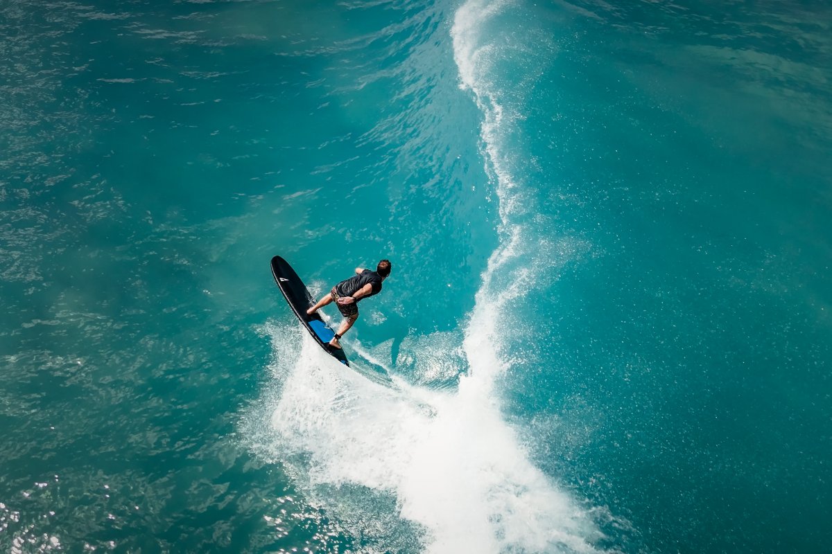 Surfer with a PHANTOM  SIC MAUI Soft surfboard